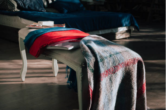 Blanket draped over legs during focused desk work