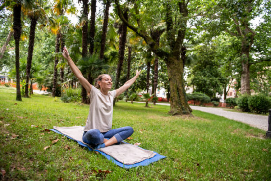 Blanket providing warmth and support during outdoor relaxation poses