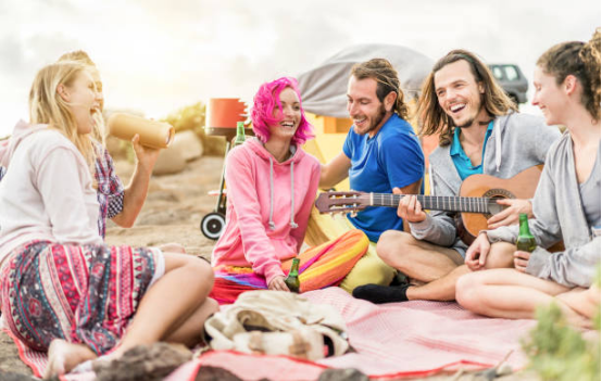 A cozy blanket on the ground at a festival providing warmth and comfort.