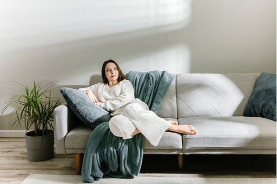 blanket used on sofa during quiet solo living moments