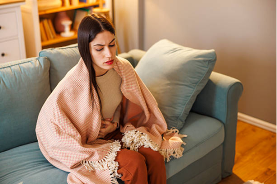 woman resting with blanket during menstrual period