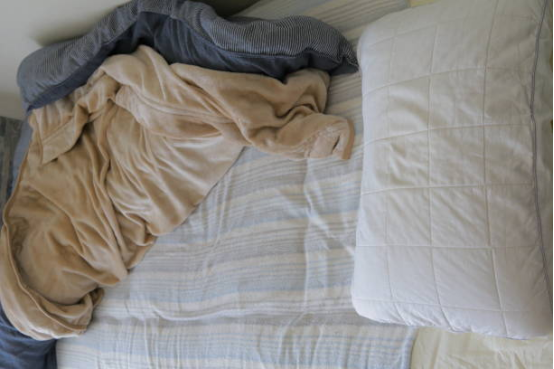 blanket used on dorm bed for better sleep comfort