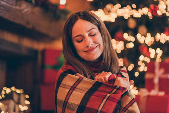 blanket used as a holiday gift on winter sofa